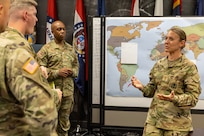 Maj. Sonja Keith, 45th Finance Center Chief of Operations, facilitates a discussion with other 45th FC Soldiers during a staff exercise at the Maj. Gen. Emmett J. Bean Federal Center in Indianapolis Oct. 30, 2024. The U.S. Army Financial Management Command hosted the exercise to increase its operational capabilities through the four phases of the conflict continuum, reduce its inefficiencies in battle tasks, and clearly identify financial management roles, responsibilities and authorities. (U.S. Army photo by Mark R. W. Orders-Woempner)