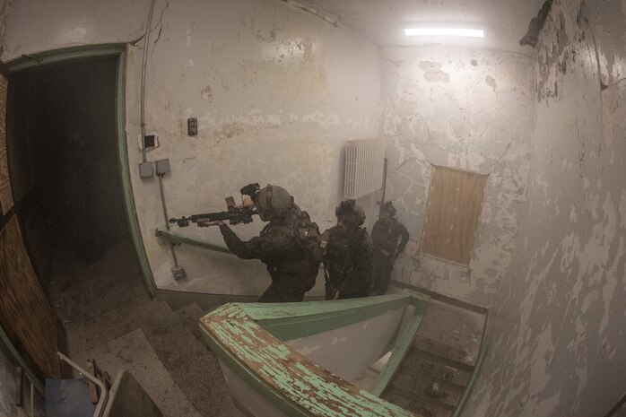 The Marine Corps Warfighting Laboratory executed Project Metropolis II ,a Dense Urban Operations limited operational experiment 2019 (DUO19) at Muscatatuck Urban Training Center (MUTC), Indiana. The event aimed to effectively combine robotics, sensors, manned/unmanned vehicles, and dismounted Marines with a focus on improving Marines' ability to sense and locate the threat, observing their speed of decision making and speed of action, and determining their lethality when employing traditional and surrogate equipment versus an enemy force in a dense urban environment. This experiment took Marines assigned to 3rd Battalion, 8th Marine Regiment, a squad-sized element from 1st Battalion, 6th Marine Regiment, and British Royal Marines assigned to 8 Troop Charlie Company, 40 Commando Royal Marines. The U.S. Marines and Royal Marine Commandos were divided into 'red' force and 'blue' force and engaged each other in a live force-on-force, free-play battle within a dense urban setting.