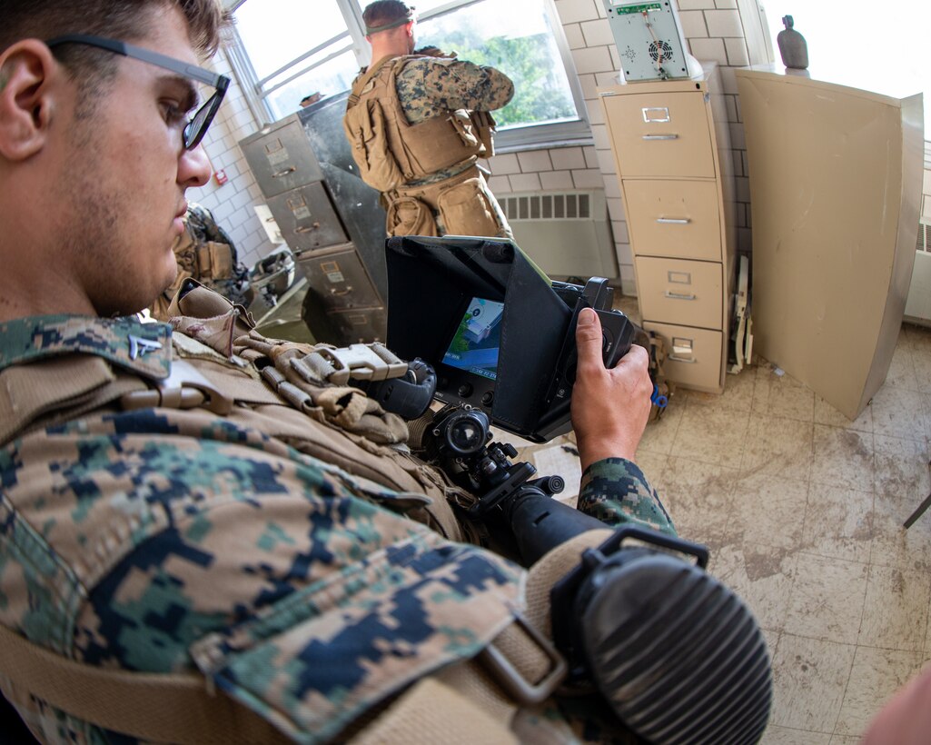 The Marine Corps Warfighting Laboratory executed Project Metropolis II ,a Dense Urban Operations limited operational experiment 2019 (DUO19) at Muscatatuck Urban Training Center (MUTC), Indiana. The event aimed to effectively combine robotics, sensors, manned/unmanned vehicles, and dismounted Marines with a focus on improving Marines' ability to sense and locate the threat, observing their speed of decision making and speed of action, and determining their lethality when employing traditional and surrogate equipment versus an enemy force in a dense urban environment. This experiment took Marines assigned to 3rd Battalion, 8th Marine Regiment, a squad-sized element from 1st Battalion, 6th Marine Regiment, and British Royal Marines assigned to 8 Troop Charlie Company, 40 Commando Royal Marines. The U.S. Marines and Royal Marine Commandos were divided into 'red' force and 'blue' force and engaged each other in a live force-on-force, free-play battle within a dense urban setting.
