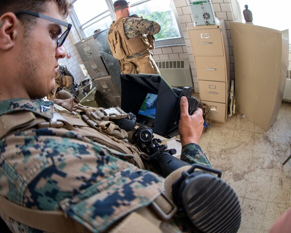 The Marine Corps Warfighting Laboratory executed Project Metropolis II ,a Dense Urban Operations limited operational experiment 2019 (DUO19) at Muscatatuck Urban Training Center (MUTC), Indiana. The event aimed to effectively combine robotics, sensors, manned/unmanned vehicles, and dismounted Marines with a focus on improving Marines' ability to sense and locate the threat, observing their speed of decision making and speed of action, and determining their lethality when employing traditional and surrogate equipment versus an enemy force in a dense urban environment. This experiment took Marines assigned to 3rd Battalion, 8th Marine Regiment, a squad-sized element from 1st Battalion, 6th Marine Regiment, and British Royal Marines assigned to 8 Troop Charlie Company, 40 Commando Royal Marines. The U.S. Marines and Royal Marine Commandos were divided into 'red' force and 'blue' force and engaged each other in a live force-on-force, free-play battle within a dense urban setting.