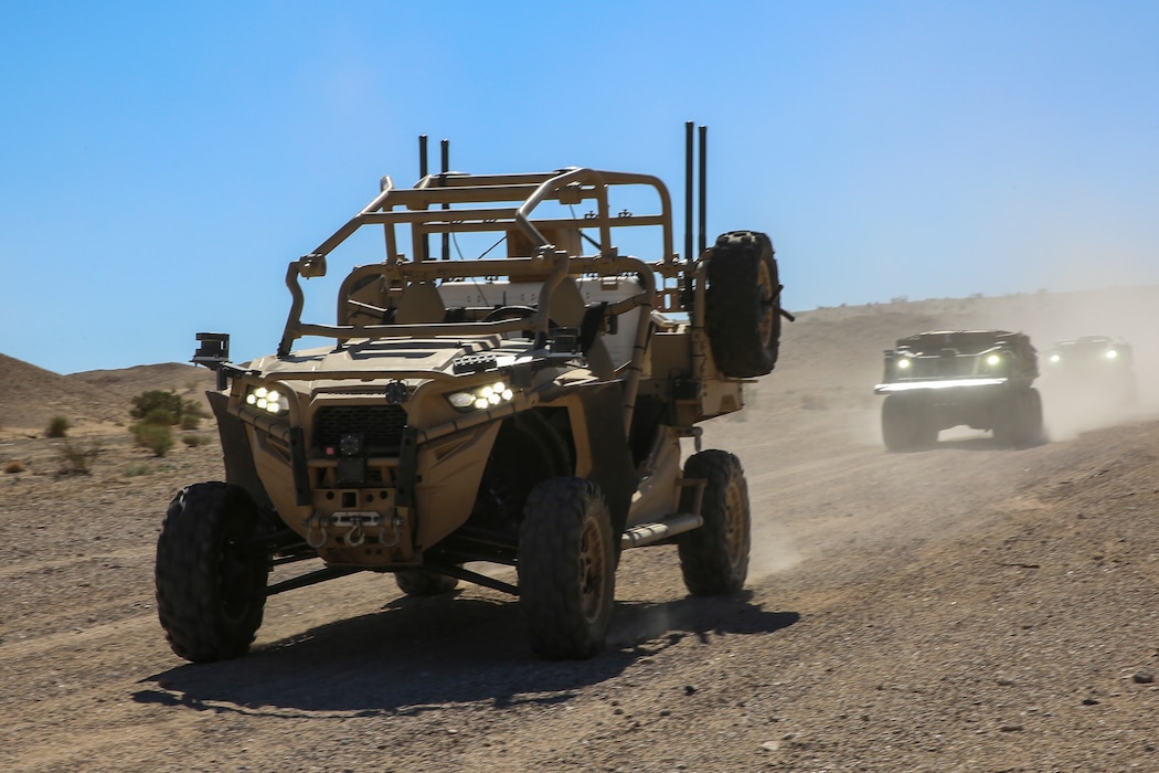 An unmanned MZRZ, known as the M-razor, light tactical vehicle leads an unmanned convoy at Marine Corps Air-Ground Combat Center, Twentynine Palms, California, Oct. 19, 2023. The M-razor by Polaris Government and Defense was designed to support infantry mobility, indirect fire, explosive ordnance disposal (EOD), command and control, logistics and missile launch missions. (U.S. Marine Corps photo by Kevin Ray J. Salvador)