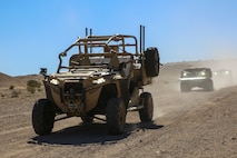 An unmanned MZRZ, known as the M-razor, light tactical vehicle leads an unmanned convoy at Marine Corps Air-Ground Combat Center, Twentynine Palms, California, Oct. 19, 2023. The M-razor by Polaris Government and Defense was designed to support infantry mobility, indirect fire, explosive ordnance disposal (EOD), command and control, logistics and missile launch missions. (U.S. Marine Corps photo by Kevin Ray J. Salvador)
