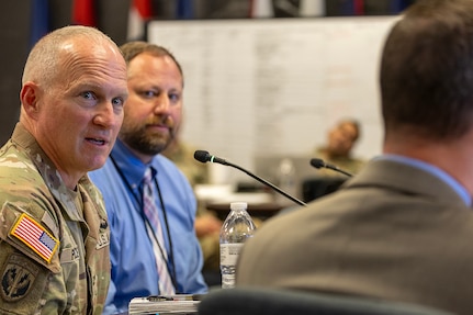 Col. Kevin D. Pierce, U.S. Army Financial Management Command chief of staff, delivers remarks at a battle update brief as Ryan A. Busby, USAFMCOM deputy to the commander, listens on during a staff exercise at the Maj. Gen. Emmett J. Bean Federal Center in Indianapolis Oct. 29, 2024. USAFMCOM hosted the exercise to increase its operational capabilities through the four phases of the conflict continuum, reduce its inefficiencies in battle tasks, and clearly identify financial management roles, responsibilities and authorities. (U.S. Army photo by Mark R. W. Orders-Woempner)