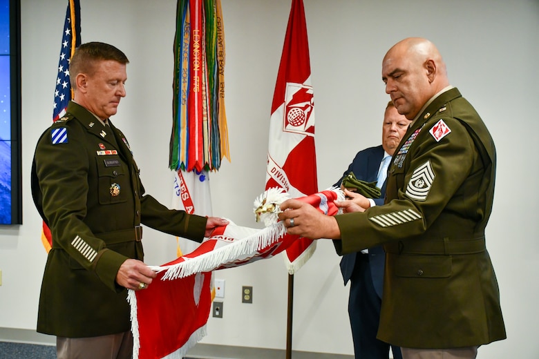 U.S. Army Col. Craig S. Baumgartner, U.S. Army Corps of Engineers Transatlantic Division commander, Command Sgt. Maj. Michael Arroyo, division senior enlisted advisor, and Scott Sawyer, Programs and Business chief, case the division colors during a Transfer of Authority ceremony in Winchester, Virginia, Aug. 5, 2025. The ceremony marked the transition of mission oversight for U.S. Central Command support from the Transatlantic Division to the U.S. Army Corps of Engineers Southwestern Division.