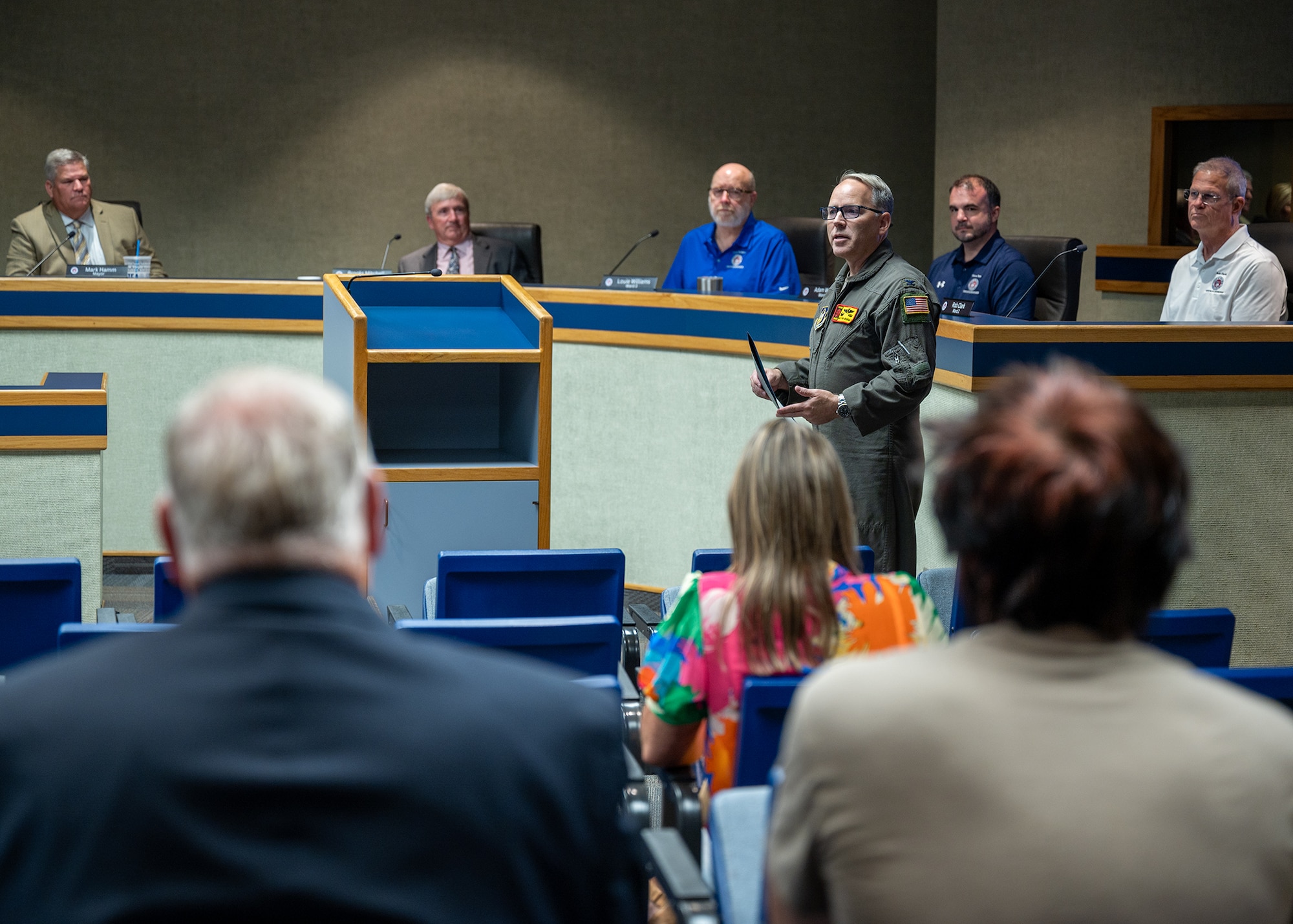 man speaks in front of audience
