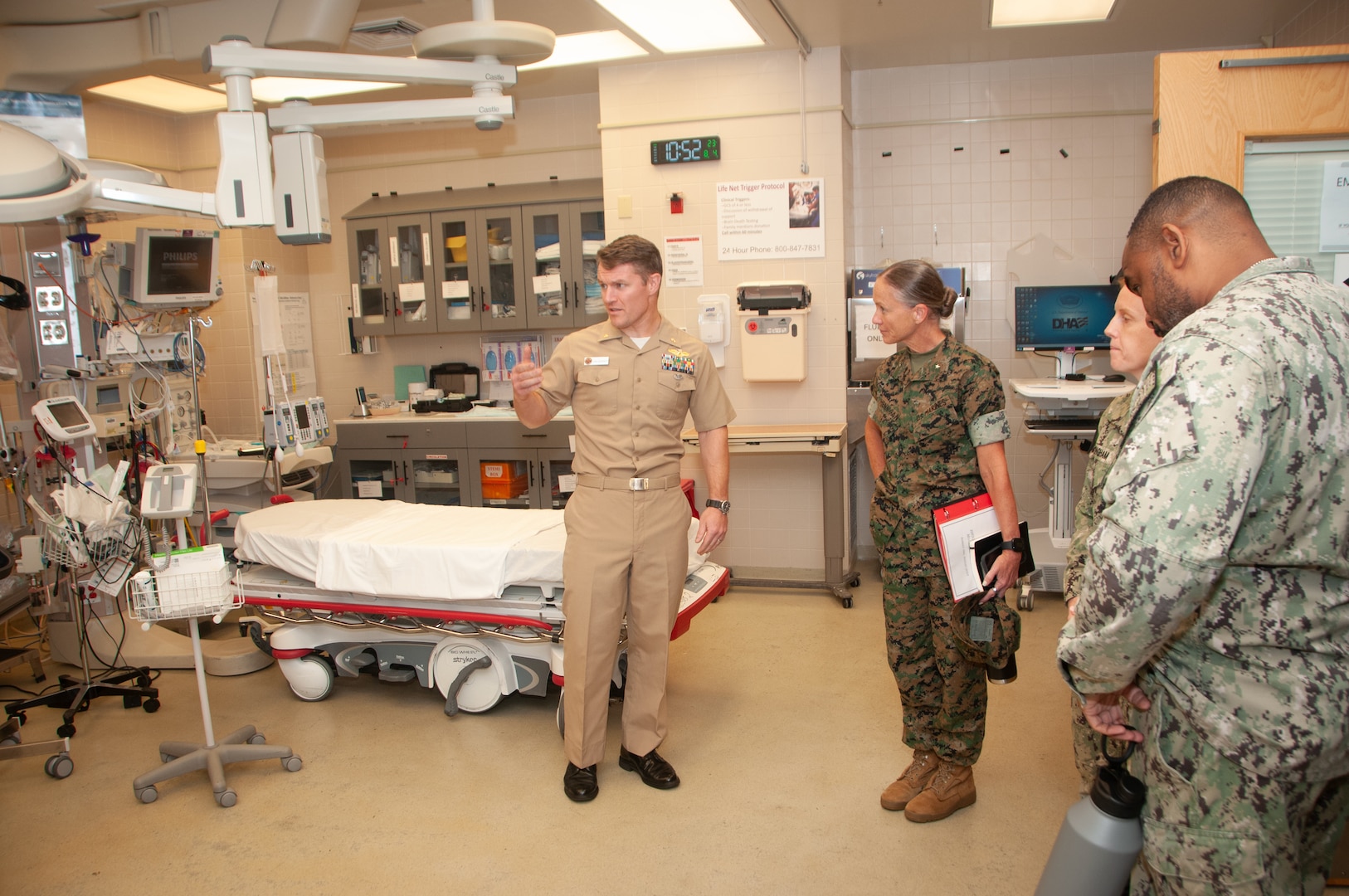 Lt. Cmdr. Liam Delahanty explains the procedures and equipment of the Naval Medical Center Portsmouth’s trauma center to Brigadier General Maura Hennigan,