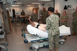 HM2 Kimaya Farrie shows Brigadier General Maura Hennigan, a state-of-the-art mannequin simulators