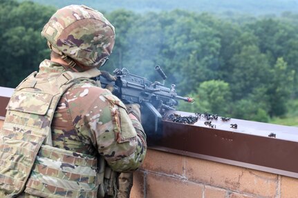 A U.S. Soldier with Charlie Company, 1st Battalion, 109th Infantry Regiment fires an M240 machine gun during an exercise at Fort Indiantown Gap, Pennsylvania, July 30, 2025. The Soldiers trained in an intensive 96 hour force-on-force exercise to simulate combat against a capable adversary. (U.S. Army National Guard photo by Staff Sgt. Zachery Jockel)