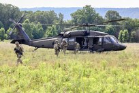 U.S. Soldiers with Charlie Company, 1st Battalion, 109th Infantry Regiment exit a UH-60 Black Hawk helicopter during an exercise at Fort Indiantown Gap, Pennsylvania, July 29, 2025. The Soldiers trained in an intensive 96 hour force-on-force exercise to simulate combat against a capable adversary. (U.S. Army National Guard photo by Staff Sgt. Zachery Jockel)