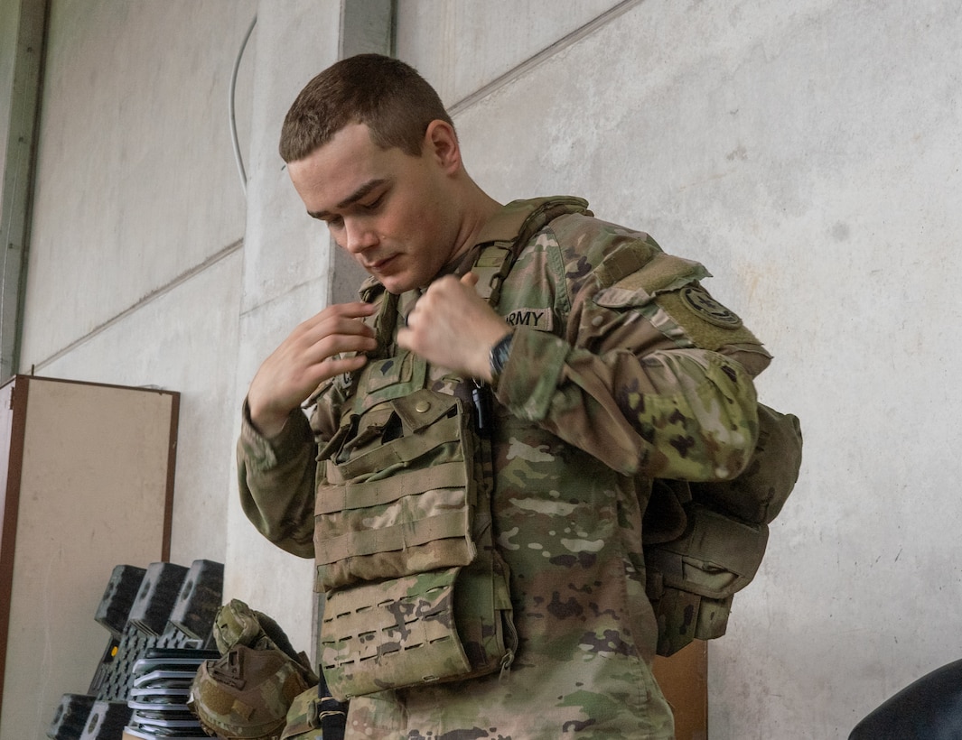 soldier wears body armor vest