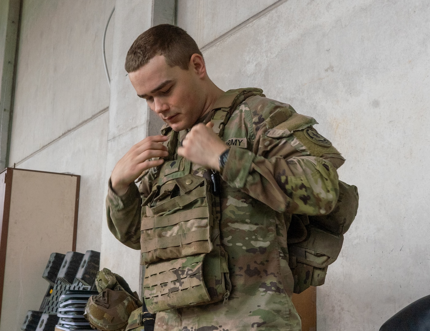 soldier wears body armor vest