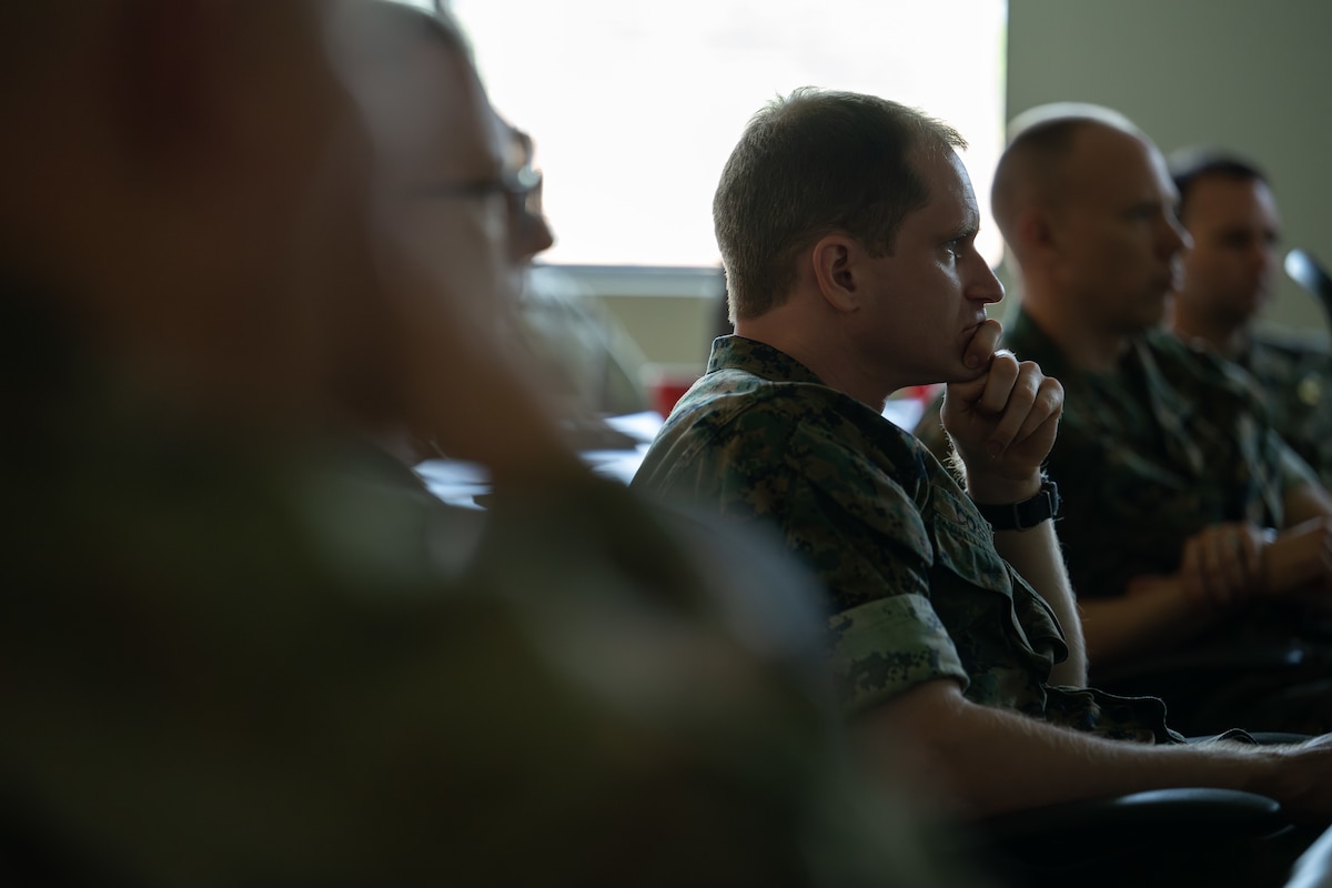 U.S, Navy Lt. Patrick Costello’s watches a video of a dignified transfer during the Chaplain Corps Mortuary Training course, a two-day course hosted by AFMAO at Dover Air Force Base, Delaware, July 29, 2025. The training prepares chaplains and religious support personnel to care for families of the fallen, covering topics such as the dignified transfer, grief counseling, and providing emotional and spiritual support. It emphasizes the chaplains' vital role as compassionate caregivers during times of loss. (U.S. Air Force photo by Jason Minto)