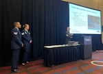 Army Sgt. 1st Class Devin Bigelow, an instructor for the Combat Medic Specialist Training Course (CMSTC) at the Medical Education and Training Campus on Joint Base San Antonio-Fort Sam Houston, Texas, delivers a presentation about the CMSTC at the American Medical Technologists Annual Meeting in Pittsburgh, Pa. July 23 while fellow METC instructors, Air Force Tech. Sgt. Jessica McCleary and Air Force Staff Sgt. Jheryl Stuckey, look on.