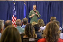 U.S. Air Force Col. Keagan McLeese, 9th Reconnaissance Wing commander, speaks during the induction ceremony for the Class of 2025 honorary commanders.
