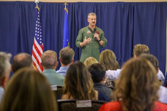 U.S. Air Force Col. Keagan McLeese, 9th Reconnaissance Wing commander, speaks during the induction ceremony for the Class of 2025 honorary commanders.