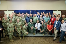 Beale Air Force Base (AFB) commanders pose for a photo with their Honorary Commander partners during the Class of 2025 Honorary Commander induction ceremony, Beale AFB, California, August 1, 2025.