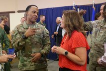 U.S. Air Force Major Douglas Cornelius, commander, 9th Contracting Squadron, with his honorary commander Janell Willis at the Beale Air Force Base Honorary Commander Induction Ceremony, Beale Air Force Base, California, August 1, 2025