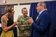 U.S. Air Force Chief Master Sgt. Steven Creek, 9th Reconnaissance Wing command chief, and spouse, Kat Creek, talk with CMSgt. Creek’s Honorary Commander, Paul Joiner.
