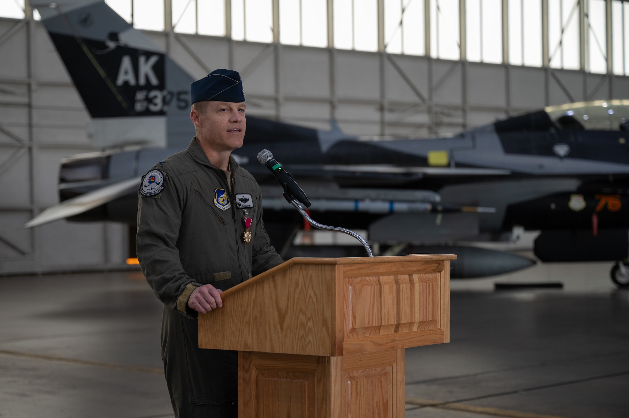 U.S. Air Force Col. Curtis Dougherty, 354th Operations Group outgoing commander, delivers a speech during a change of command ceremony at Eielson Air Force Base, Alaska, Aug. 5, 2025.