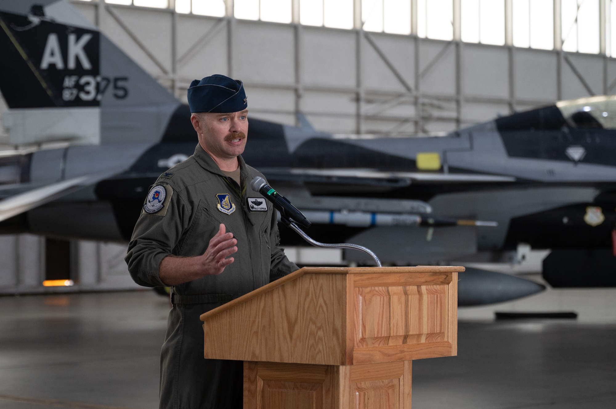 U.S. Air Force Col. Samuel Chipman, 354th Operations Group incoming commander, delivers a speech during a change of command ceremony at Eielson Air Force Base, Alaska, Aug. 5, 2025.