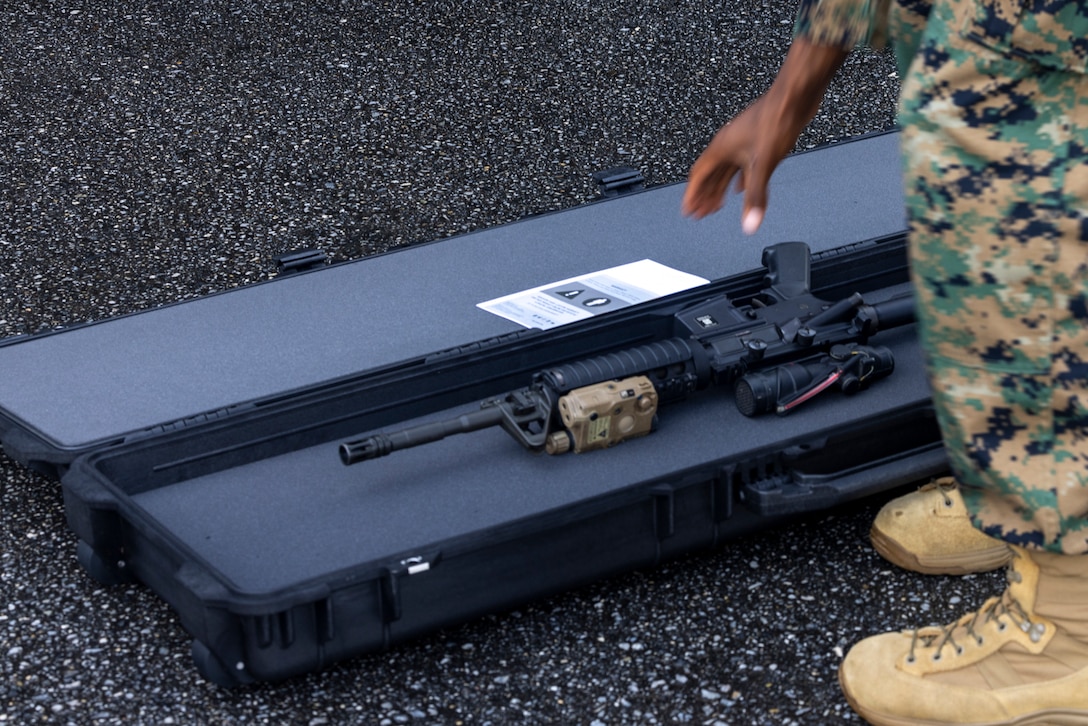 U.S. Marine Corps Capt. Stephen Price stores his M4 carbine rifle in a Pelican rifle case during an Alert Contingency Marine Air Ground Task Force (ACM) drill on Camp Courtney, Okinawa, Japan, July 15, 2025. The ACM exercise is a simulated crisis response drill that must be executed within 24 hours to prepare Marines to mitigate emergencies, provide humanitarian aid, or counter threats to U.S. national interests within the Indo-Pacific region. Price, a native of Georgia, is a logistics officer with 3D Marine Expeditionary Brigade. (U.S. Marine Corps photo by Lance Cpl. Jeffrey Pruett)