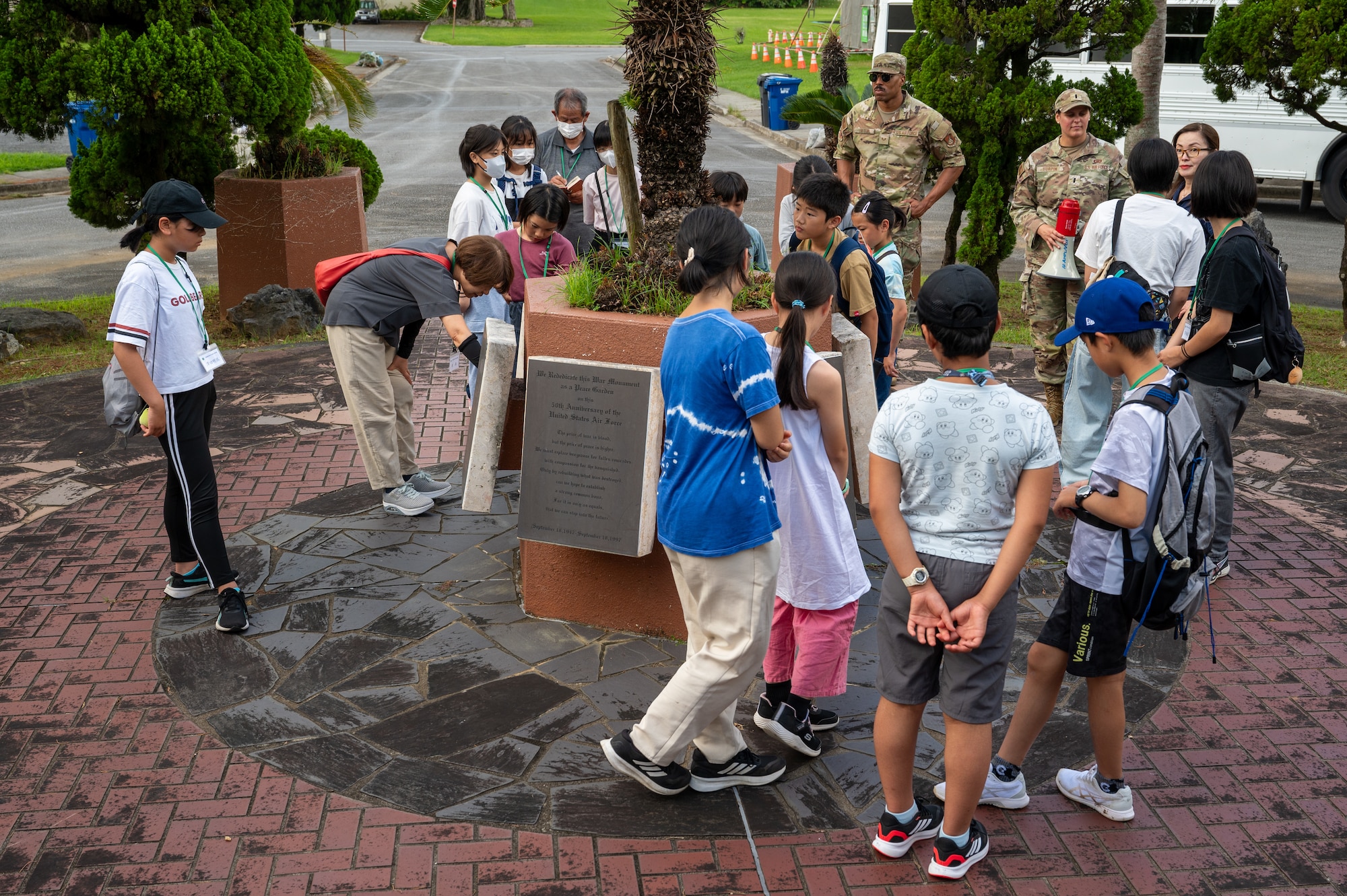 Achi-Mura students learning about the Peace Garden at Kadena Air Base