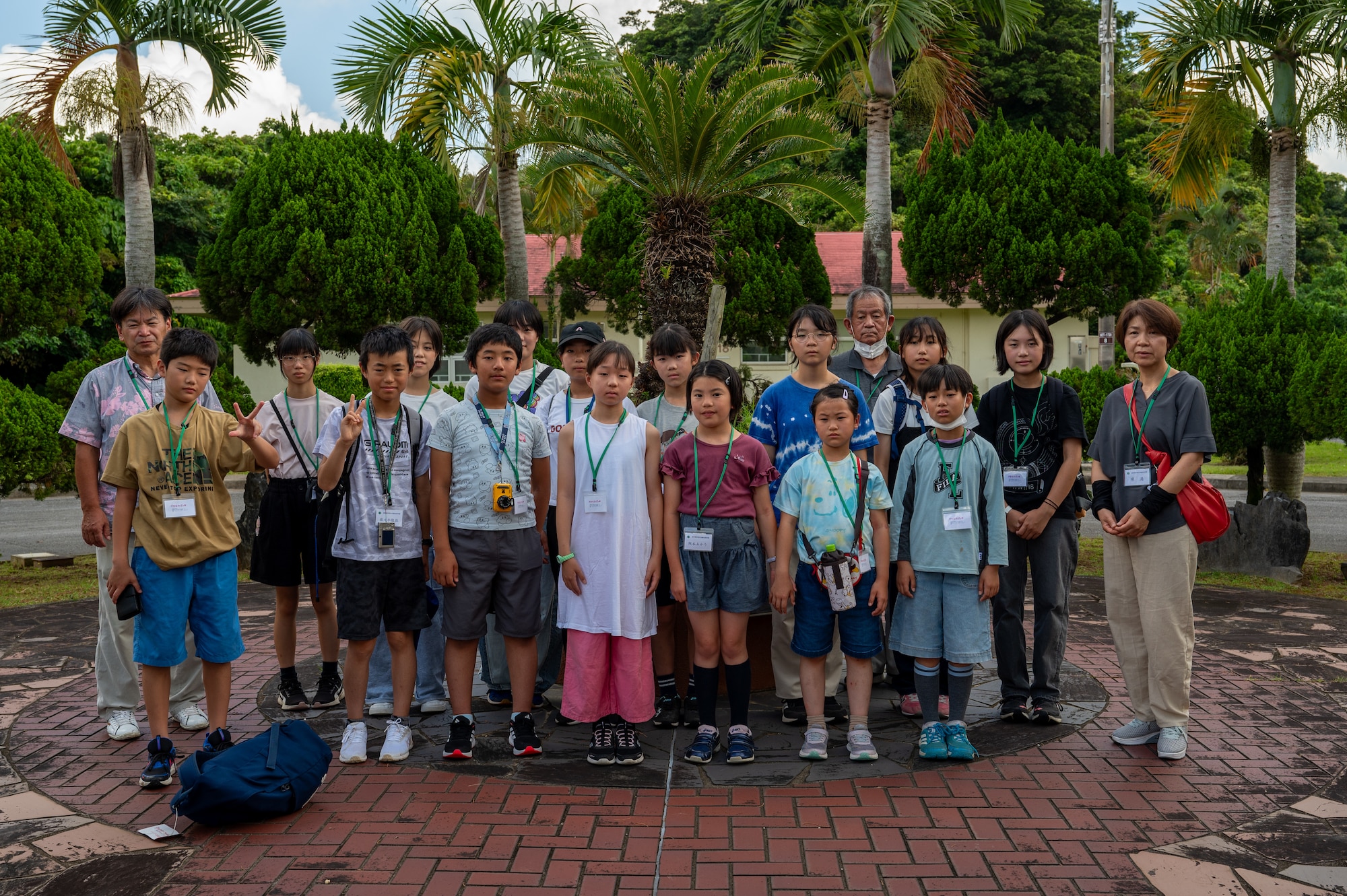 Achi-Mura students and teachers pose for a group photo at the Peace Garden in Kadena Air Base