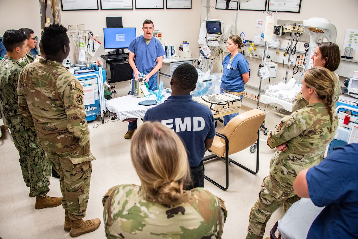 A group of 134th Airmen listen to instruction from a Naval Hospital employee.