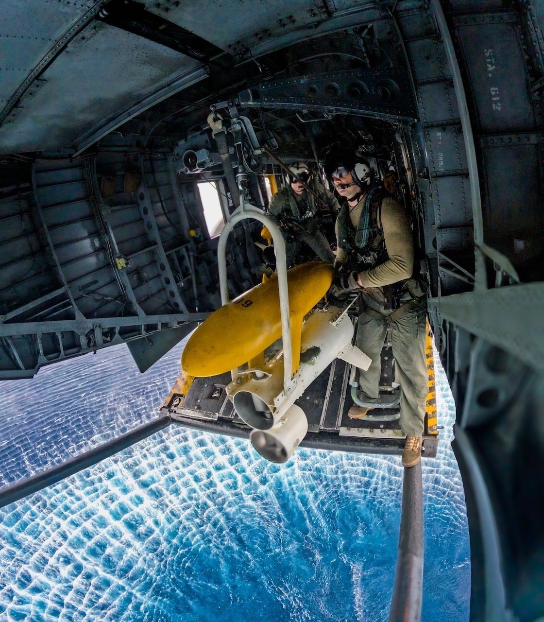 Chief Naval Aircrewman Helicopter Bradley Caldbeck and Naval Aircrewman Helicopter 1st Class Drake Dunlap stream the Mk-104 acoustic sweep system from a MH-53E Sea Dragon helicopter during Mine Warfare Exercise (MINEX) 2JA near Ominato, Japan, July 19, 2025.