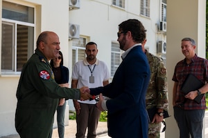 Turkish air force Brig. Gen. Kemal Gültekin, 10th Main Jet Base Command commander, shakes hands with U.S. Congressman Dan Crenshaw, Chairman of the Subcommittee on Defense, Intelligence & Overhead Architecture, during a visit to Incirlik Air Base, Türkiye, July 27, 2025.