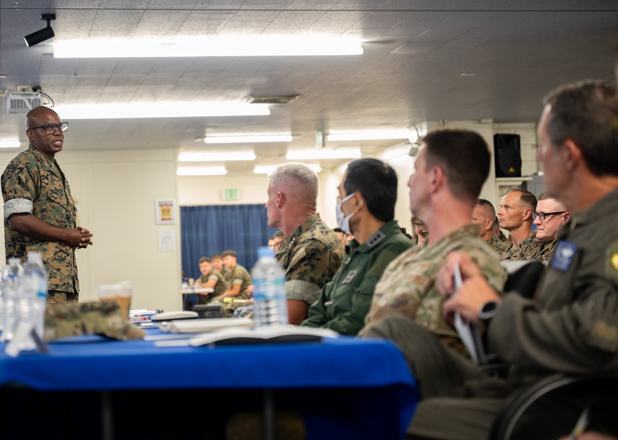 U.S. Marine Corps Brig. Gen. Douglas C. Sanders, 1st Marine Aircraft Wing Assistant Wing commander, provides closing remarks during the Bilateral Defense of Okinawa Working Group outbrief at Kadena Air Base, Japan, August 1, 2025.