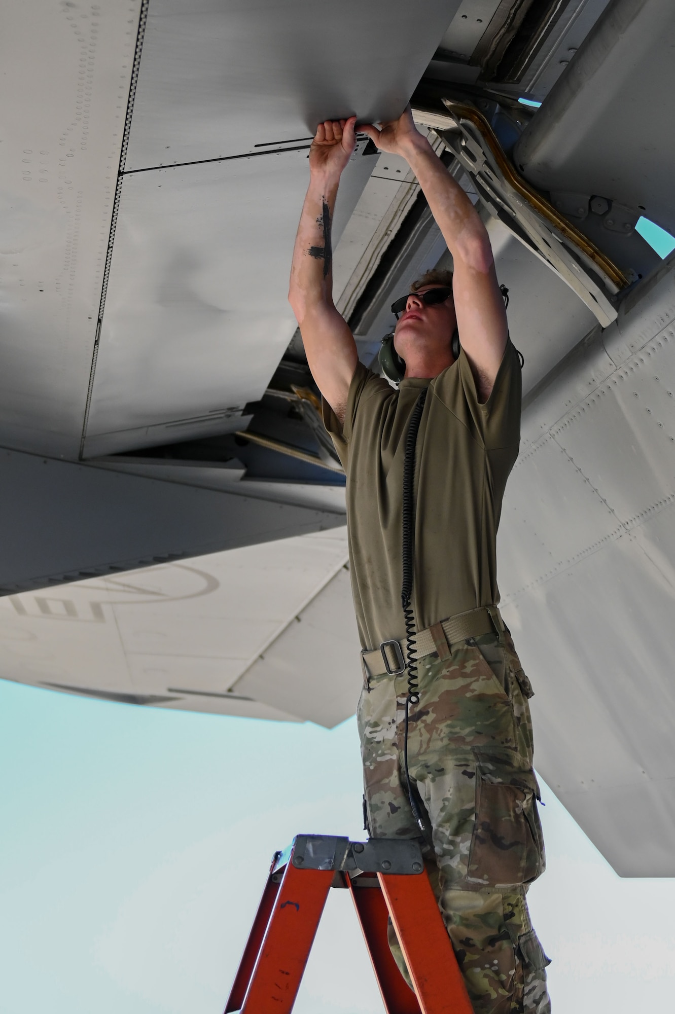 U.S. Air Force Airman 1st Class Connor Habusta, 100th Aircraft Maintenance Squadron crew chief, performs maintenance on a U.S. Air Force KC-135 Stratotanker at RAF Mildenhall, England, July 11, 2025.