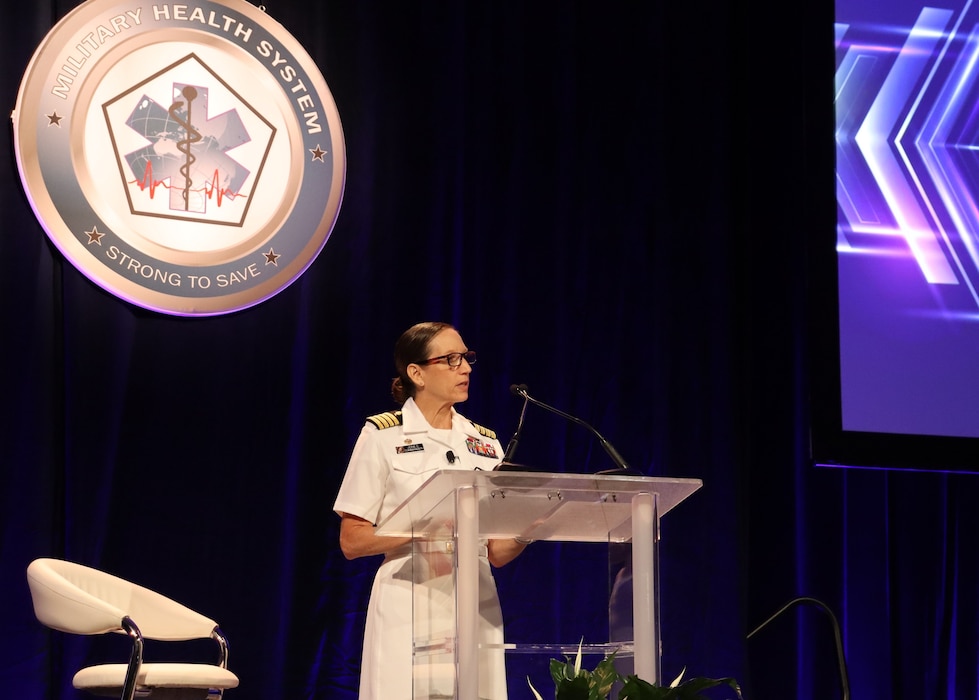 KISSIMMEE, Fla. (Aug. 4, 2025) Capt. Franca Jones, commander, Naval Medical Research Command (NMRC), speaks to attendees at the plenary session for the 2025 Military Health Research Symposium. MHSRS is the DoD’s premier scientific meeting that focuses specifically on the unique medical needs of service members. This annual educational symposium brings together healthcare professionals, researchers, and DoD leaders for four days of critical learning, intensive idea sharing and relationship building. NMR&D, a global collective of eight commands led by NMRC, conducts research in support of Navy, Marine Corps and joint U.S. warfighter health, readiness and lethality, across a broad spectrum of activity from basic science in the laboratory to field studies in austere and remote areas of the world to investigations in operational environments. NMR&D studies infectious diseases, biological warfare detection and defense, combat casualty care, environmental health concerns, directed energy health effects, aerospace and undersea medicine, medical modeling, simulation, operational mission support, epidemiology and behavioral sciences. (U.S. Navy Photo by Emily Swedlund/ released)