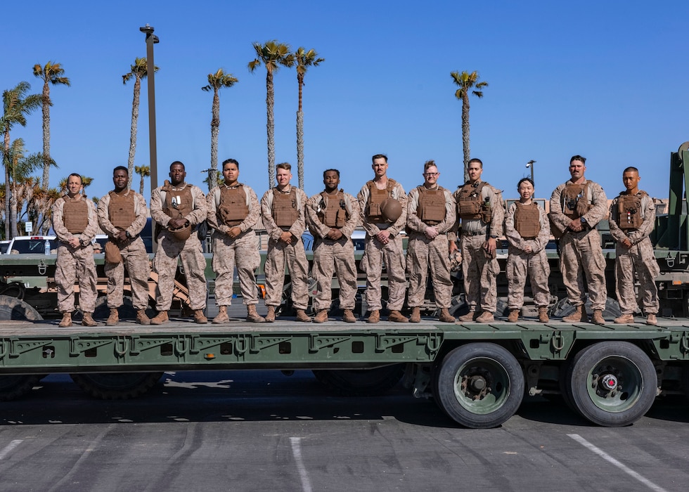 U.S. Navy Sailors assigned to I Marine Expeditionary Force pose for a group photo near Imperial Beach, Calif., March 18, 2025. Task Force Sapper is composed of 500 Marines and sailors from I Marine Expeditionary Force who have been tasked with engineering support to U.S. Northern Command with the emplacement of physical barriers along the Southern Border barrier to add additional security that will curtail illegal border crossings. Under the direction of the U.S. Northern Command, Joint Task Force Southern Border aligns efforts to seal the southern border and repel illegal activity and is responsible for full-scale, agile, and all-domain operations, which will allow for more effective and efficient DoD operations. (U.S. Marine Corps photo by Lance Cpl. Nataly Espitia)