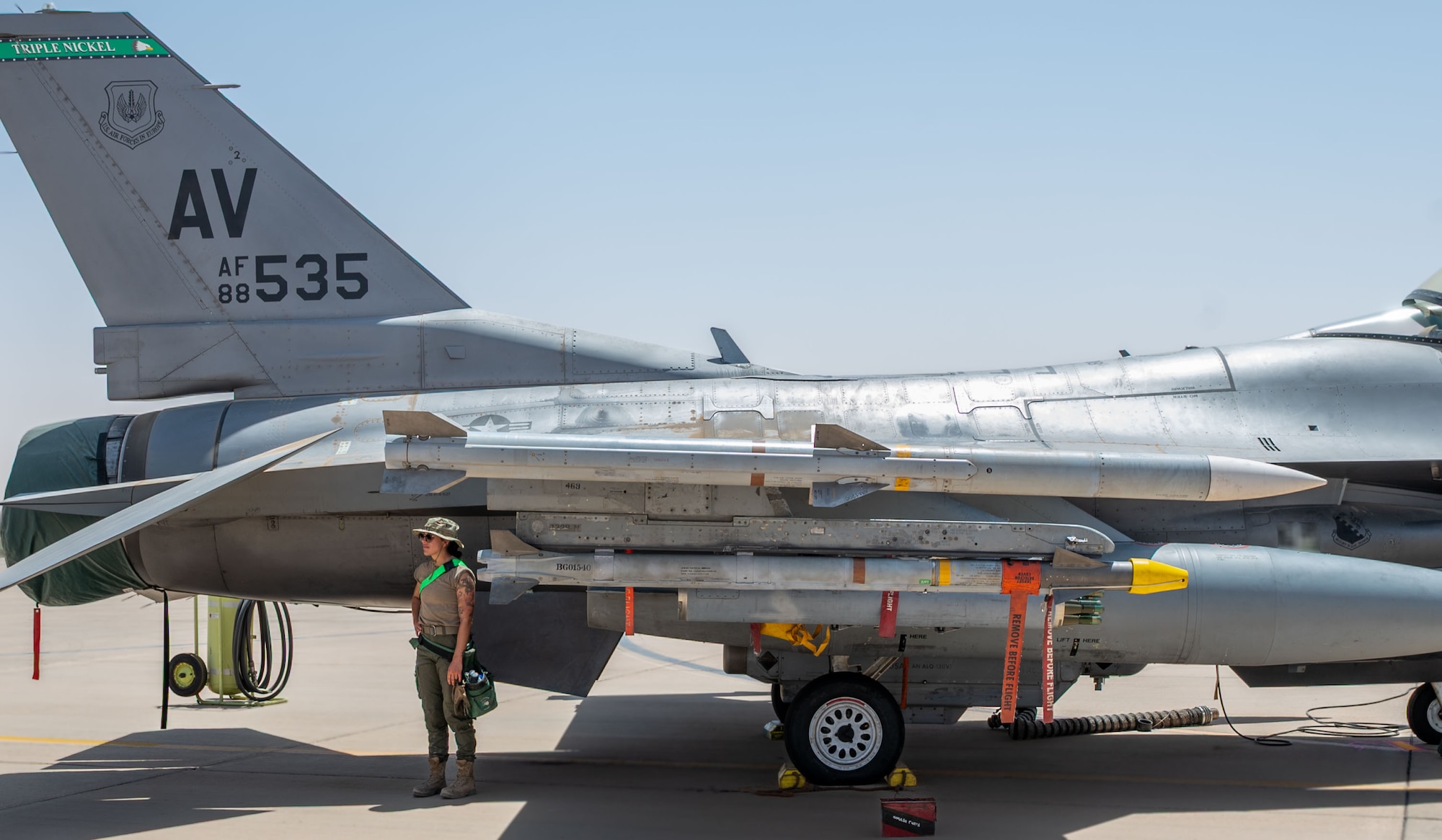 An Airman stands by an F-16 Fighting Falcon.