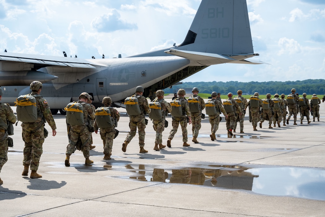 Soldiers of the 412th Civil Affairs Battalion board a KC-130 Aircraft to conduct a jump exercise at Wright-Patterson Air Force Base, Ohio, Aug. 2, 2025.  Based in Columbus, Ohio, the 412th is a U.S. Army Reserve unit that regularly conducts parachute training exercises and airborne operations. (U.S. Air Force photo by Jack Gardner)