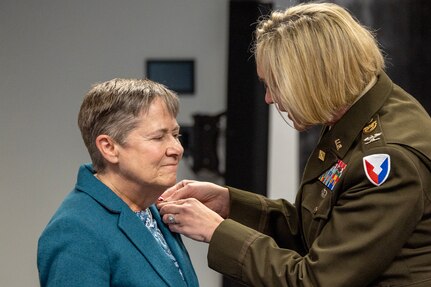 Col. Michelle M. Williams, U.S. Army Financial Management Command commander, presents Susan Gillison, USAFMCOM Military Pay Operations director, with a Department of the Army Superior Civilian Service Medal during Gillison’s retirement ceremony at the Maj. Gen. Emmett J. Bean Federal Center in Indianapolis Oct. 28, 2024. Gillison, a Mercer, Pennsylvania native, is an Army veteran whose service to the nation spans 41 years with more than 2 years in the U.S. Army Reserve, more than 21 years in the Regular Army, and more than 17 years of government civilian service with the Defense Finance and Accounting Service and USAFMCOM. (U.S. Army photo by Mark R. W. Orders-Woempner)