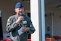 U.S. Air Force Col. Chris G. Cain, 2nd Bomb Wing commander, gives opening remarks for National Night Out