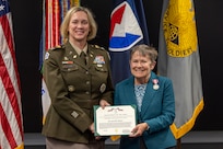 Col. Michelle M. Williams, U.S. Army Financial Management Command commander, presents Susan Gillison, USAFMCOM Military Pay Operations director, with a Department of the Army Superior Civilian Service Medal during Gillison’s retirement ceremony at the Maj. Gen. Emmett J. Bean Federal Center in Indianapolis Oct. 28, 2024. Gillison, a Mercer, Pennsylvania native, is an Army veteran whose service to the nation spans 41 years with more than 2 years in the U.S. Army Reserve, more than 21 years in the Regular Army, and more than 17 years of government civilian service with the Defense Finance and Accounting Service and USAFMCOM. (U.S. Army photo by Mark R. W. Orders-Woempner)