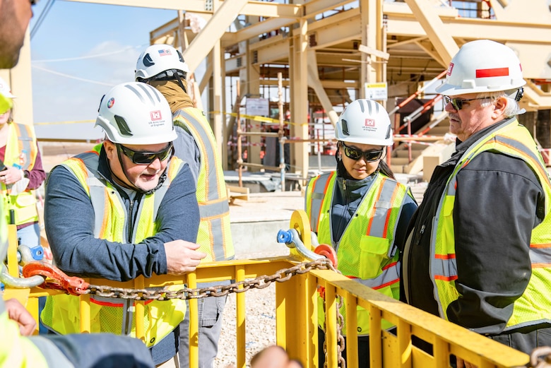 3 safety specialists inspect a project site