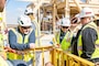 3 safety specialists inspect a project site