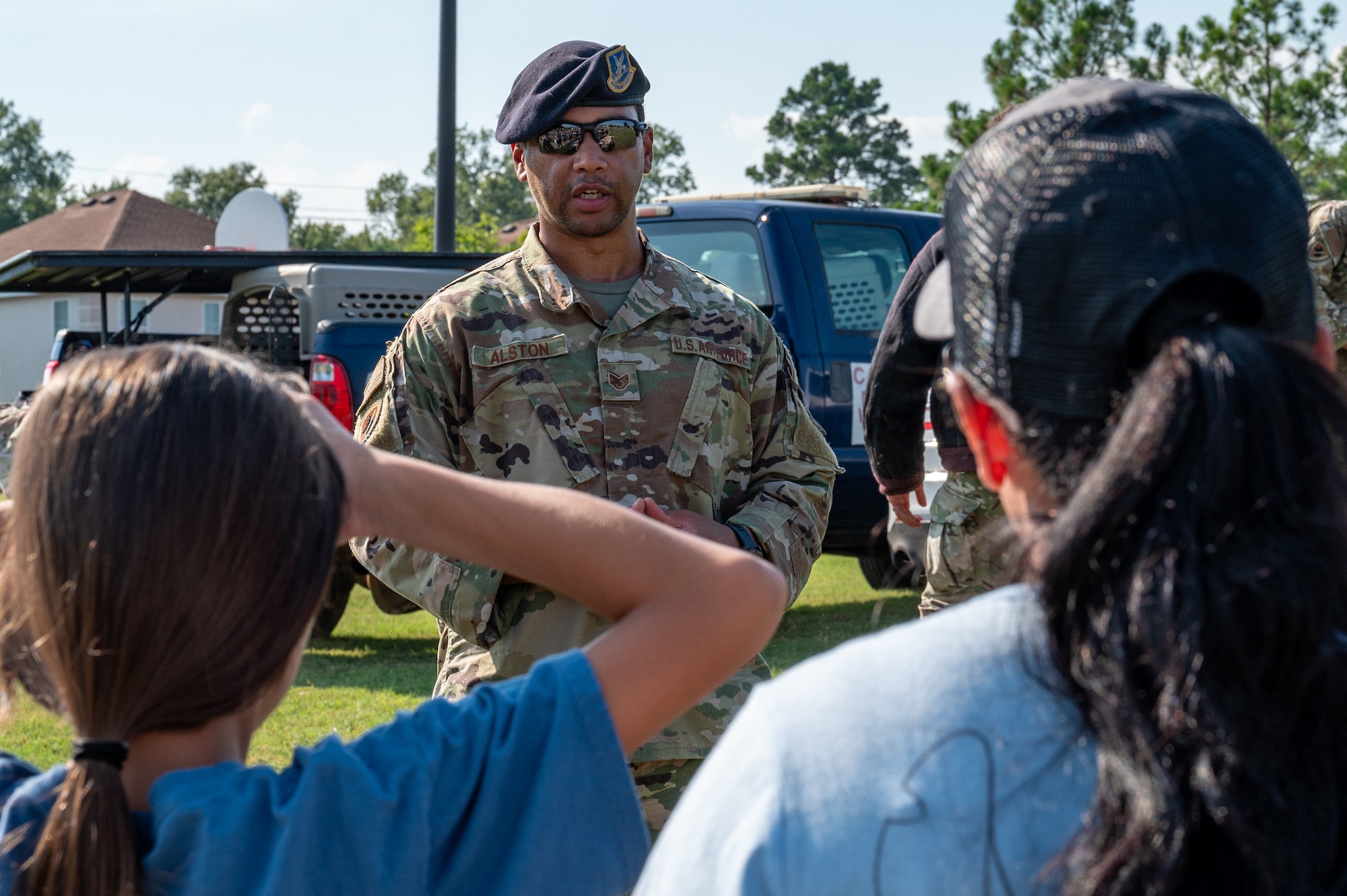 U.S. Air Force Staff Sgt. Christian Alston, 2nd Security Forces Squadron military working dog handler, explains how military working dogs are trained
