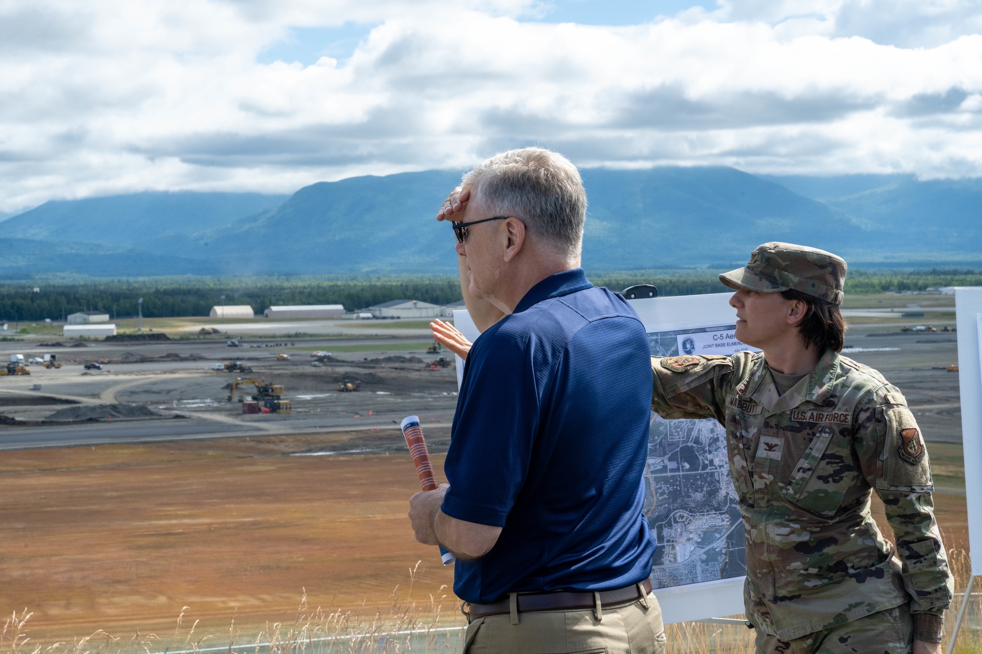 Secretary of the Air Force Troy Meink and U.S. Air Force Col. Lisa Mabbutt, Joint Base Elmendorf-Richardson and 673rd Air Base Wing commander, discuss plans for future construction projects.