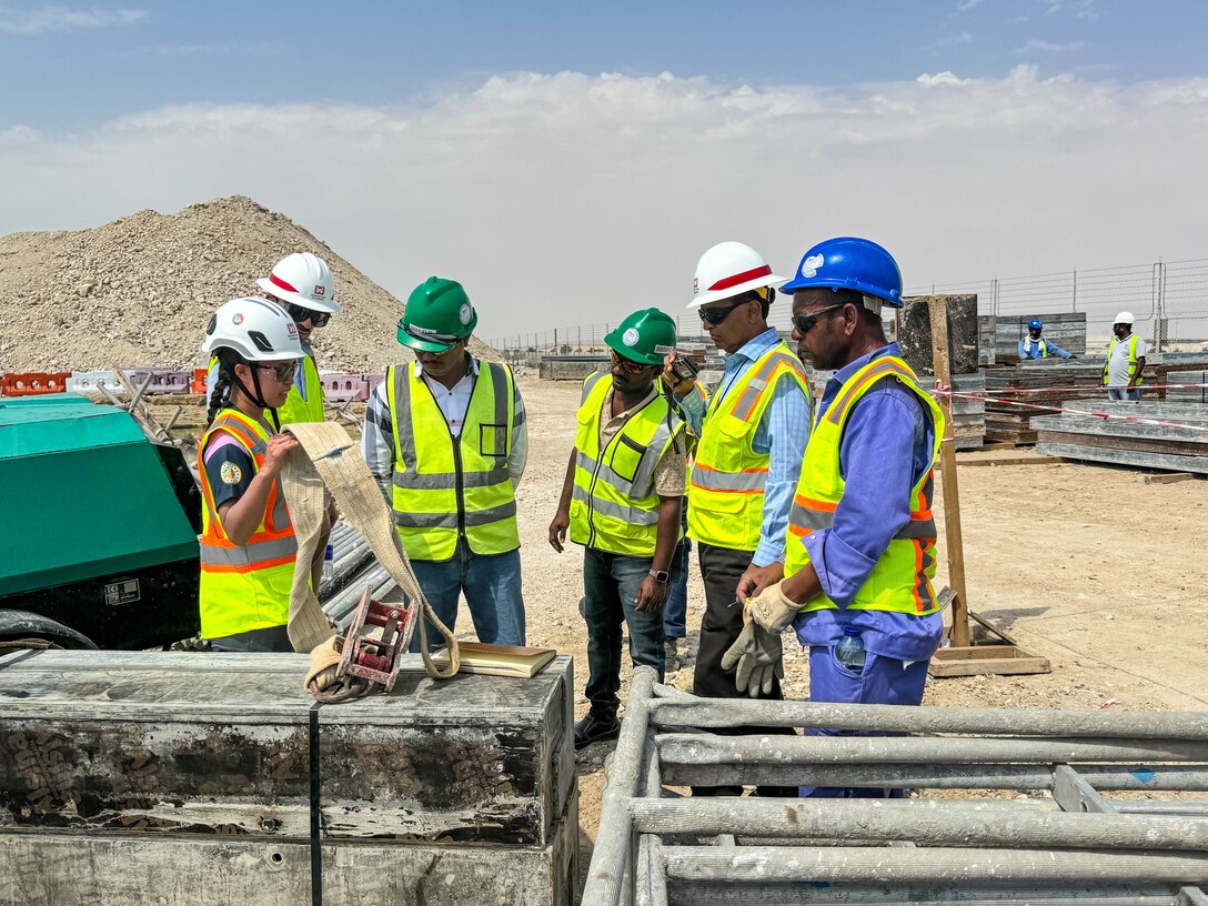 Safety specialist explains to a group of people how to identify worn equipment.