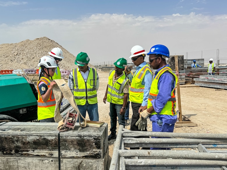 Safety specialist explains to a group of people how to identify worn equipment.