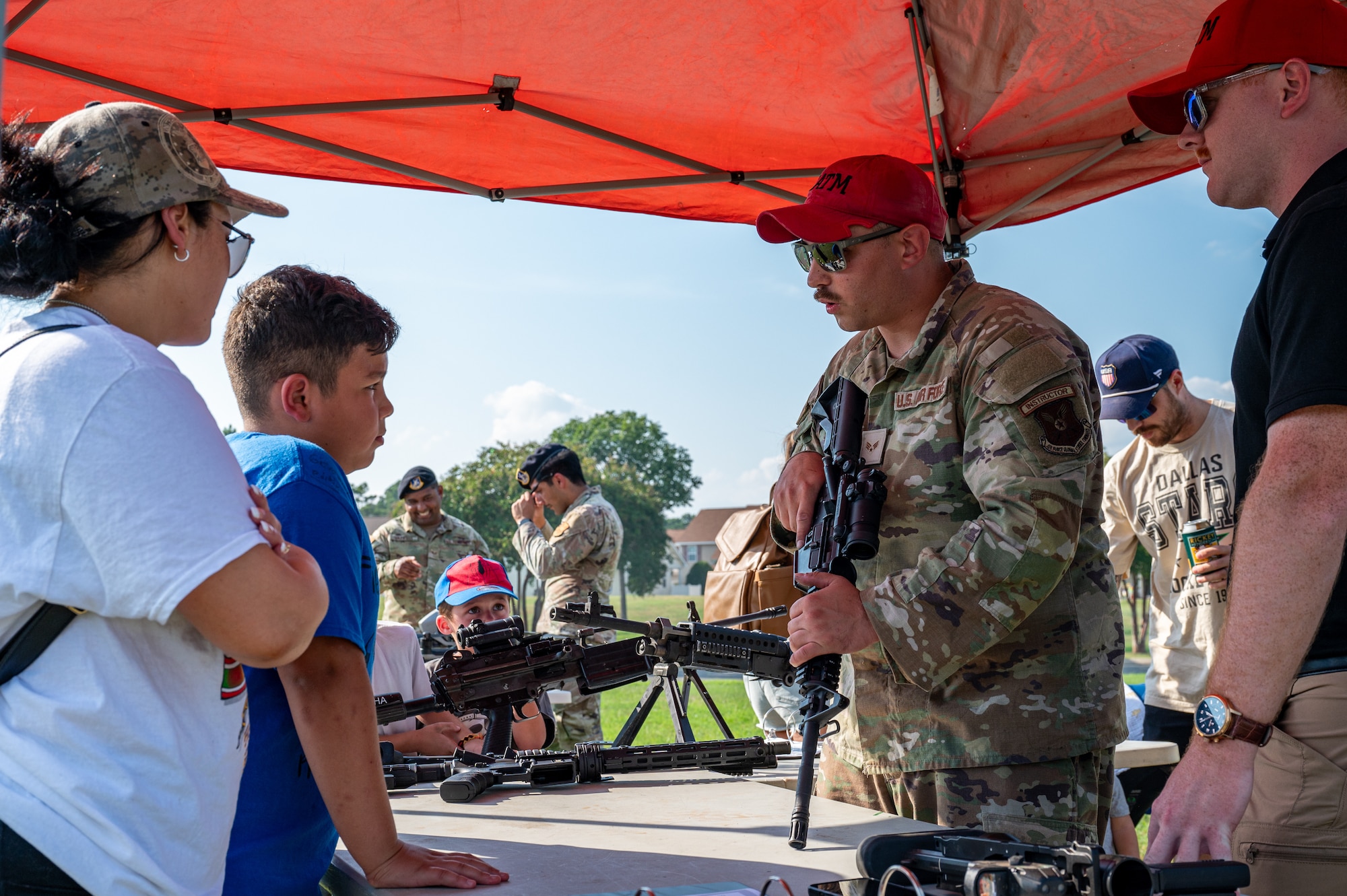 U.S. Air Force Senior Airman Richard Stiller, 2nd Security Forces Squadron combat arms training and maintenance instructor, explains how CATM oversees weapons maintenance and repair