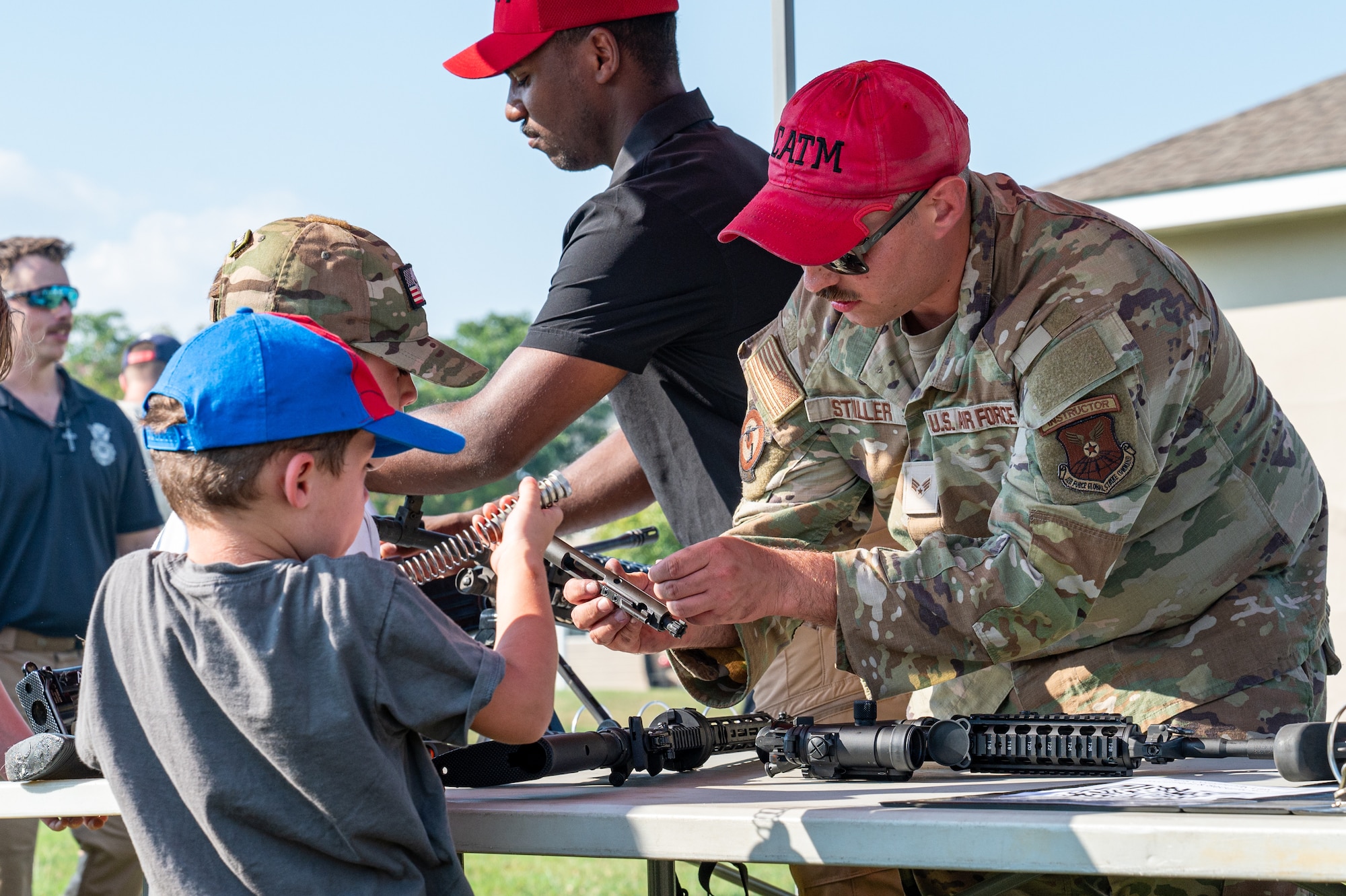 U.S. Air Force Senior Airman Richard Stiller, 2nd Security Forces Squadron combat arms training and maintenance instructor, demonstrates how to disassemble a weapon
