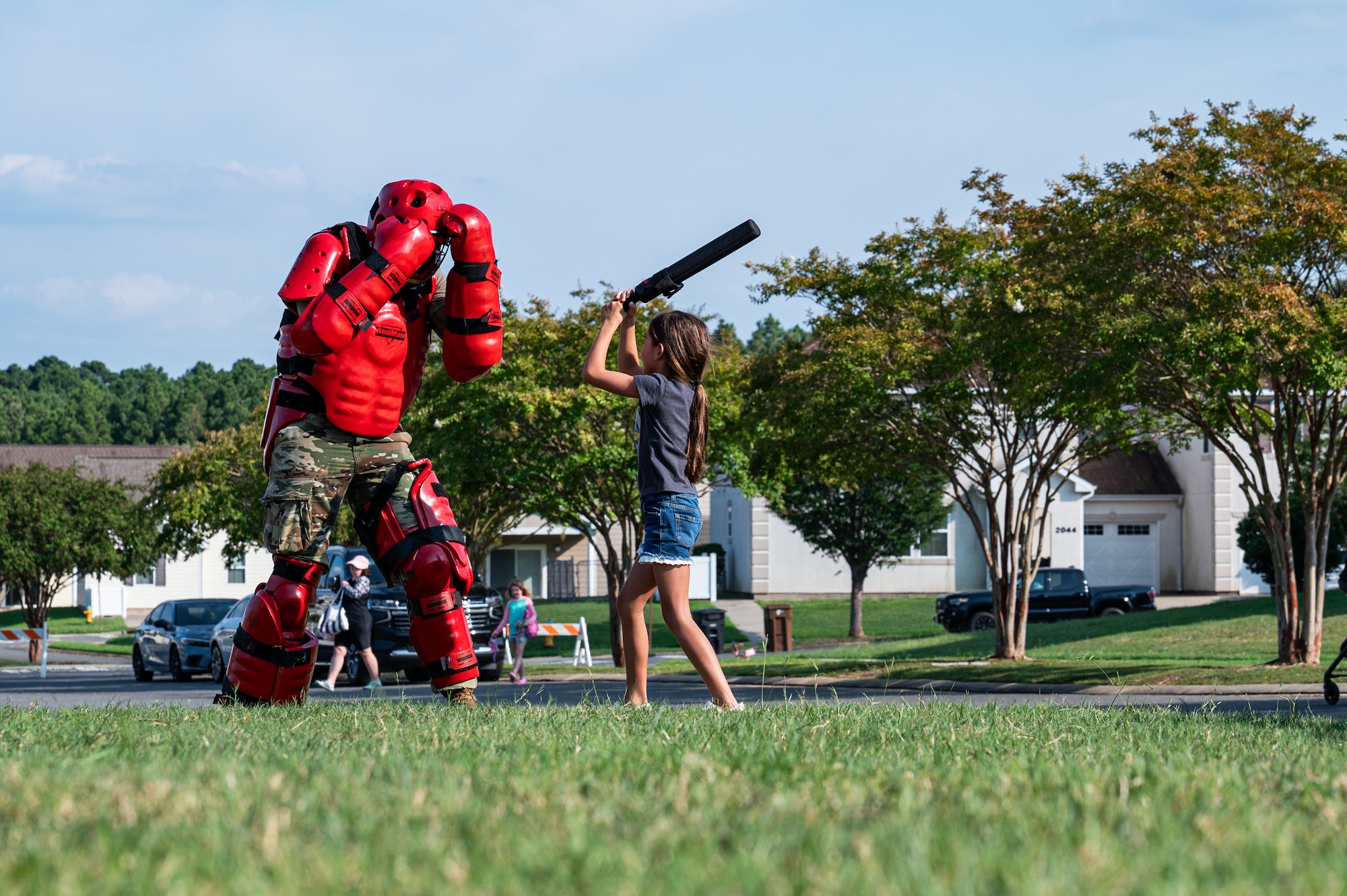 U.S. Air Force Airman Janorris Sejour, 2nd Security Forces Squadron patrolman, wears the red man training suit to teach children about defensive tactics training