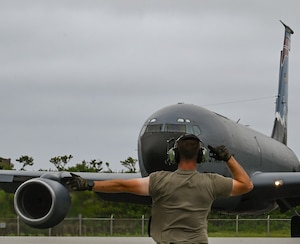An Airman marshals a KC-135 Stratotanker from the Utah Air National Guard's 151st Air Refueling Wing during Resolute Force Pacific 25 in the Indo-Pacific region, July 24, 2025