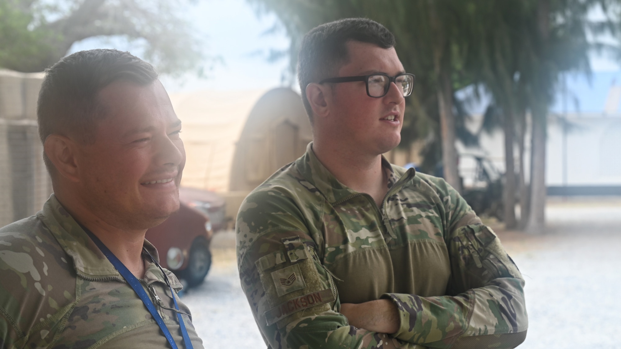 Two men in military uniform look out over Camp Simba in Manda Bay Kenya.